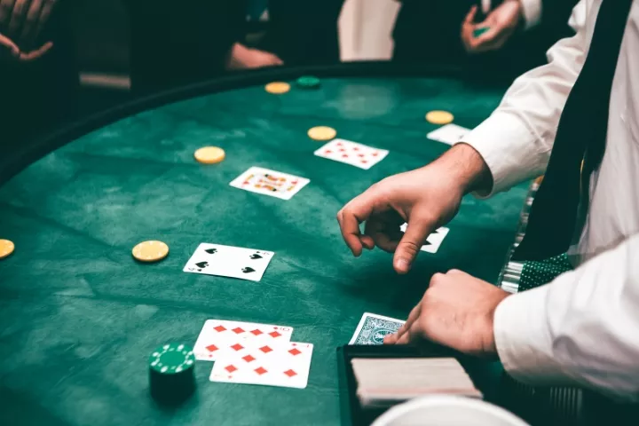 Blackjack table with a dealer.